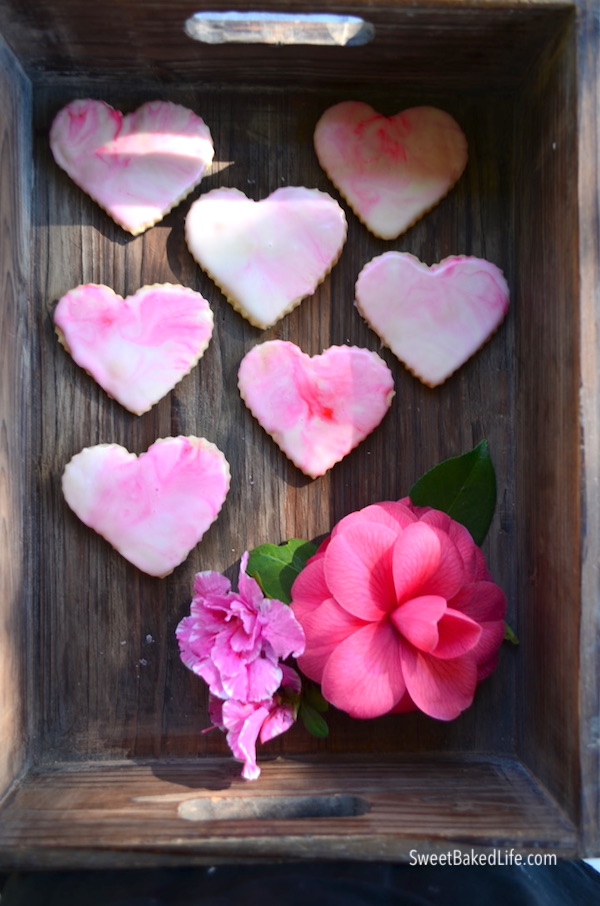 Pretty and delicious - pink glazed heart shortbread cookies | @sweetbakedlife.com
